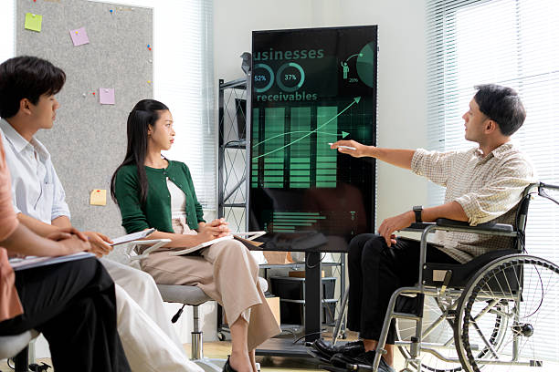 NDIS consultants presenting business growth chart